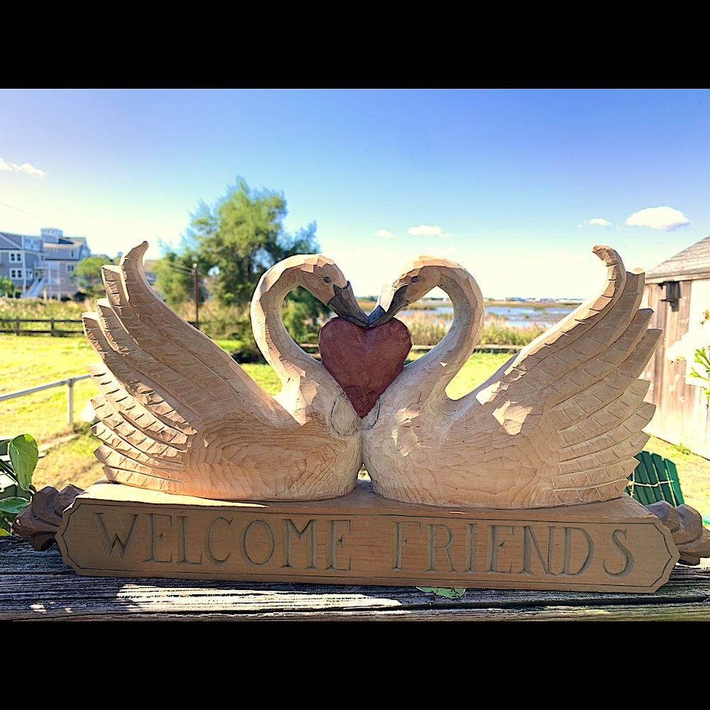 Hand carved wood Swans by “Rain Tree Carvings”